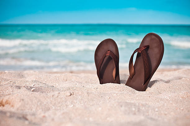 Sandals on the white beaches of Varadero Cuba. Short depth of field.